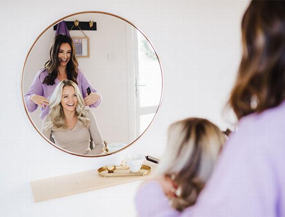 charlotte with client looking at hair