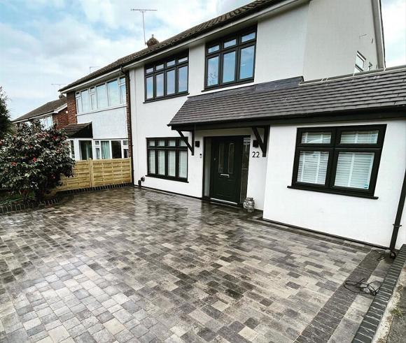 New home renovation with newly laid brick driveway